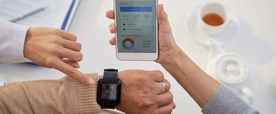 Health information demonstrated on smartphone and watch