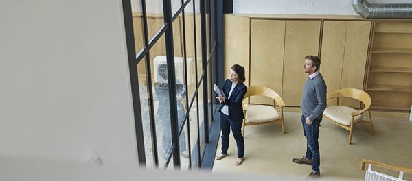 Commercial property owners reviewing the inside of a building