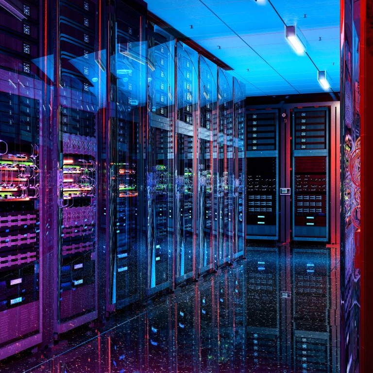 Data center corridor with rows of server racks and network equipment under blue and purple lighting, representing cyber incident preparedness.
